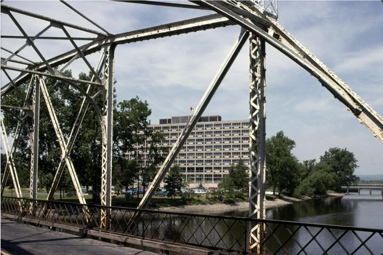 Diefenbaker Building 58 - exterior view of 1958 building from south east through Minto Bridge