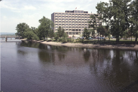 Diefenbaker Building 57 - exterior view across Riodeau River of 1958 building from south