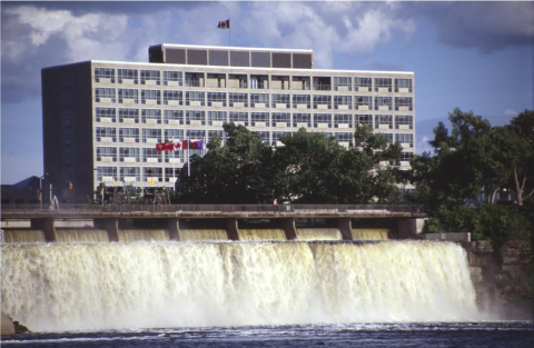 Diefenbaker Building 59 - exterior view of the City Hall looking over Rideau Falls from Ottawa River