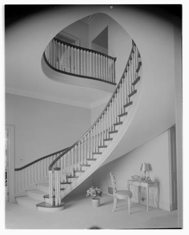 Curving staircase in the main hallway of 24 Sussex Drive
